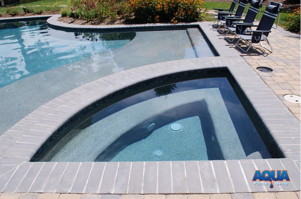 This custom hot tub in the Bennett Point area of Queenstown Maryland features a complimentary triangular shape.